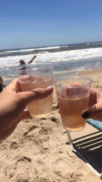 Cheers! Drinking cocktails on the beach in the Hamptons. 