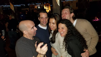 Group of young NYC professionals enjoying their night on their ski resort vacation. 
