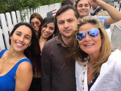 A group of people pose for a selfie on their Hamptons vacation. 