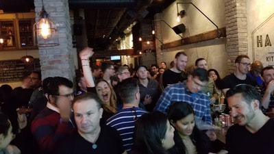 The crowd at a super bowl party in NYC. 