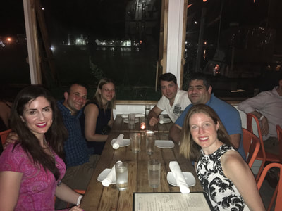 young professionals from nyc enjoy dinner at swallow east on their weekend trip to montauk