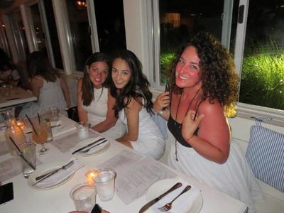 A group of girls eating at one of the finest restaurants in the Hamptons. 