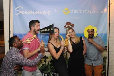 Friends pose with goofy props during their Hamptons vacation organized by  davidshapiro.net. 