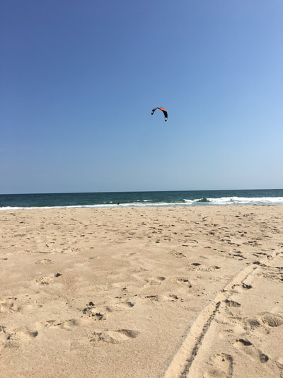 a kite flying over our private hamptons beach